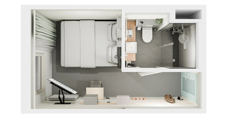 Ein Bett, das im Budgetzimmer des baltica Hamburg Altona steht.