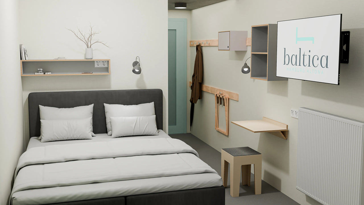 Ein Bett im Budget-Zimmer des Baltica Hamburg Altona